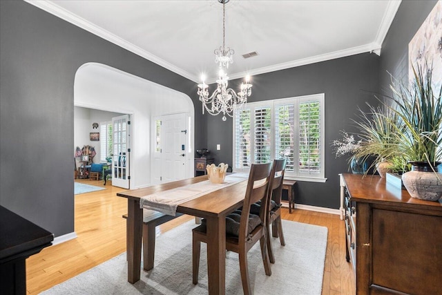 555 Pointe Of Oaks Rd, Summerville, SC 29485 - dining space with crown molding, a chandelier, light wood-type flooring, and baseboards