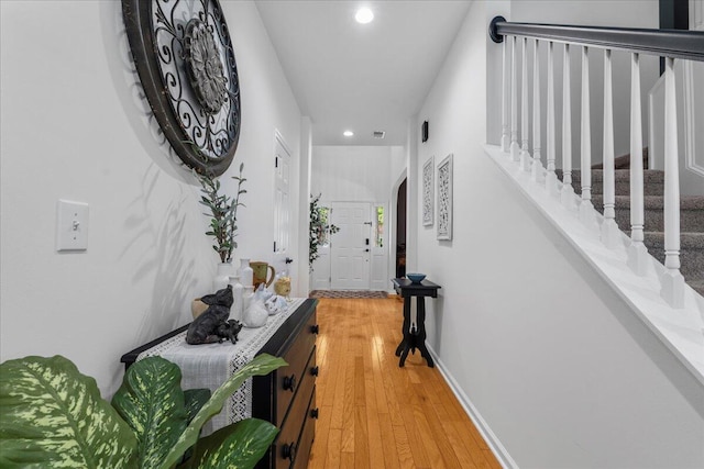 555 Pointe Of Oaks Rd, Summerville, SC 29485 - hall with recessed lighting, light wood-style flooring, and stairs