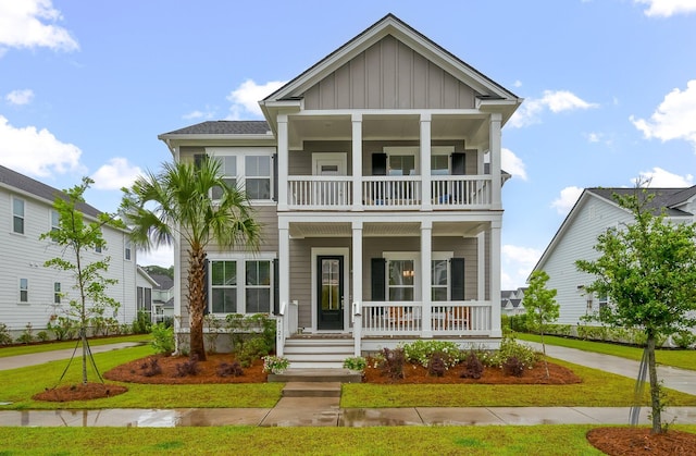 4129 Maidstone Dr, Mount Pleasant, SC 29466 - view of front of property with a balcony, board and batten siding, a porch, and a front yard