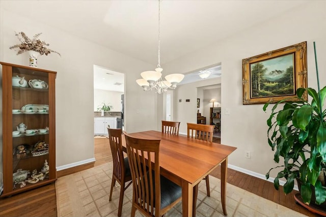 2132 Summerwood Dr, Mount Pleasant, SC 29466 - dining room with wood finished floors, a chandelier, and baseboards