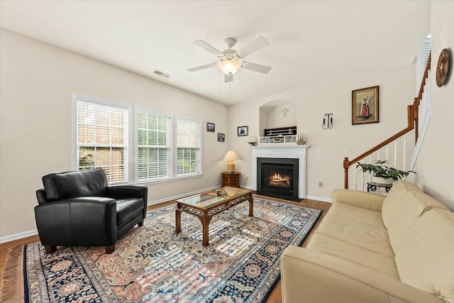 2132 Summerwood Dr, Mount Pleasant, SC 29466 - living room featuring wood finished floors, a ceiling fan, a fireplace with flush hearth, and baseboards