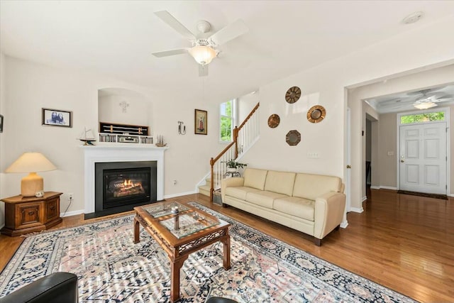 2132 Summerwood Dr, Mount Pleasant, SC 29466 - living room with a ceiling fan, stairway, wood finished floors, a glass covered fireplace, and baseboards
