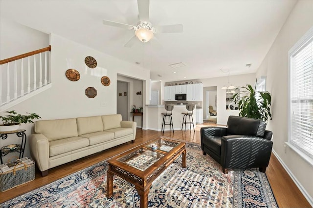 2132 Summerwood Dr, Mount Pleasant, SC 29466 - living room featuring wood finished floors, a ceiling fan, stairway, and baseboards