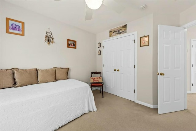 2132 Summerwood Dr, Mount Pleasant, SC 29466 - bedroom with light colored carpet, a closet, baseboards, and a ceiling fan