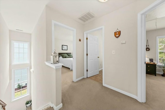 2132 Summerwood Dr, Mount Pleasant, SC 29466 - hallway featuring light colored carpet, baseboards, and attic access