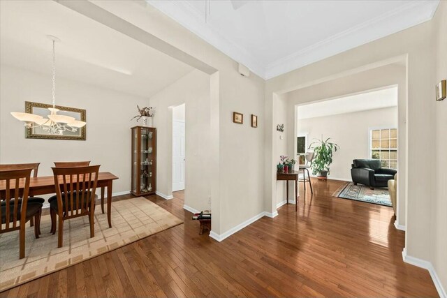 2132 Summerwood Dr, Mount Pleasant, SC 29466 - dining area with hardwood / wood-style flooring, a chandelier, baseboards, and crown molding
