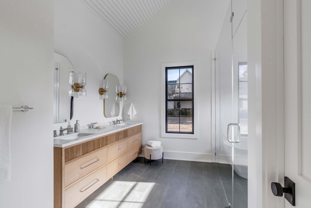 bathroom featuring vanity, an enclosed shower, and high vaulted ceiling