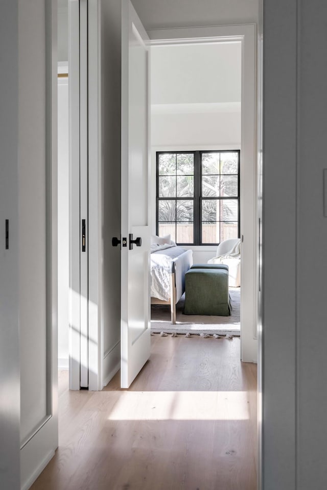 hall with light wood-type flooring