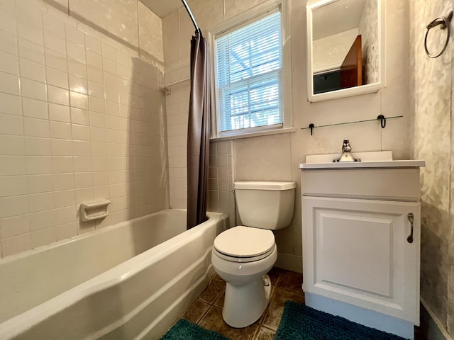 full bath with toilet, tile patterned flooring, vanity, and shower / bath combination with curtain