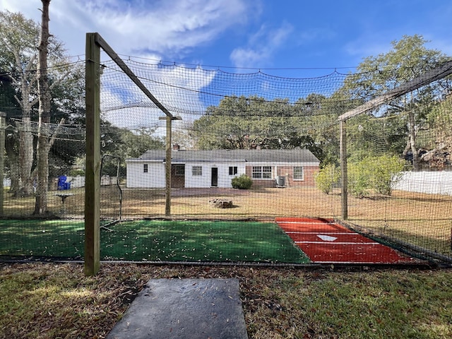 exterior space featuring fence and a front lawn