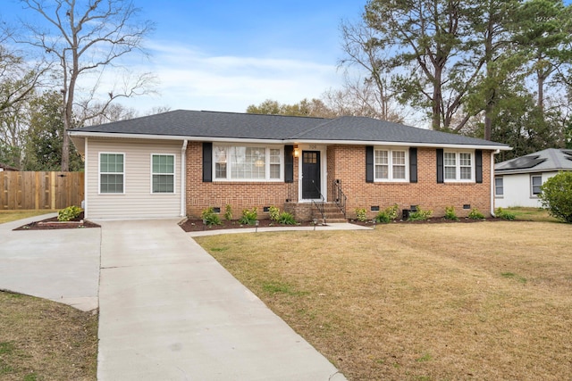 ranch-style home with a front lawn, crawl space, fence, and brick siding