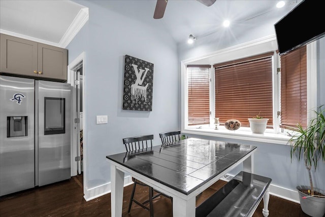 dining area with lofted ceiling, ceiling fan, crown molding, and dark hardwood / wood-style flooring