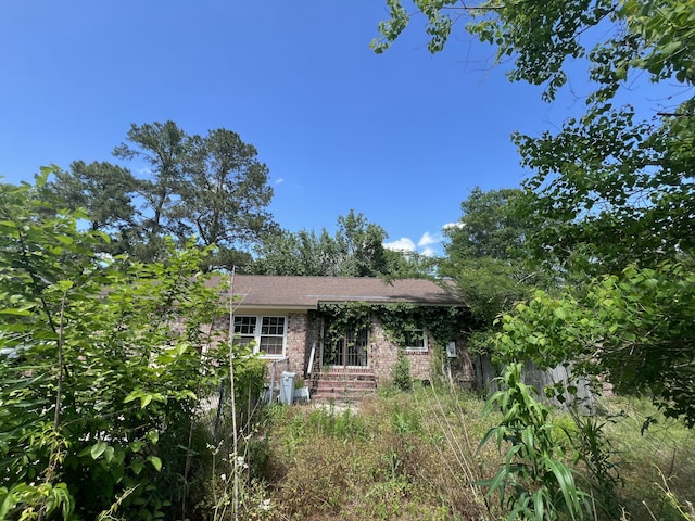 view of front of home with brick siding