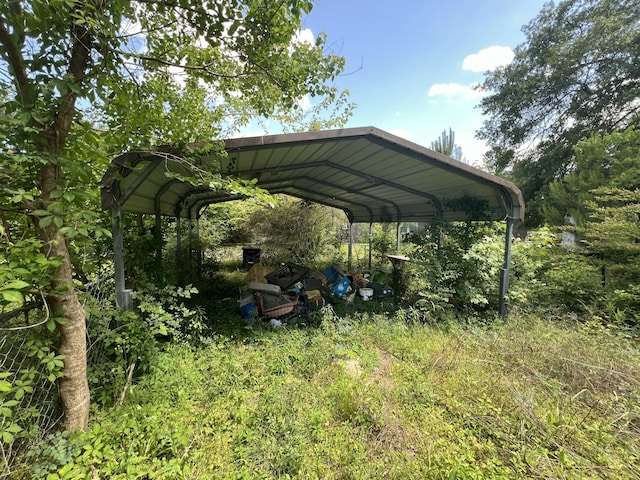 view of parking / parking lot featuring a detached carport