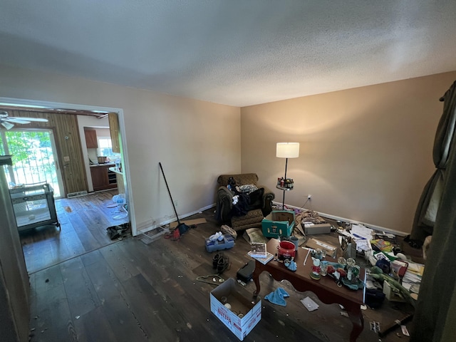 interior space featuring wood-type flooring and a textured ceiling
