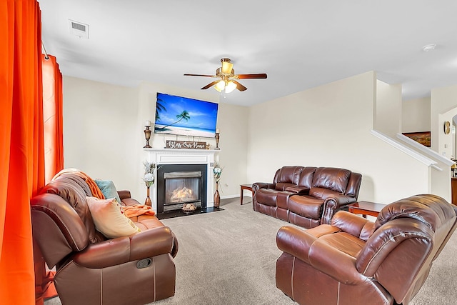 living room featuring light colored carpet and ceiling fan