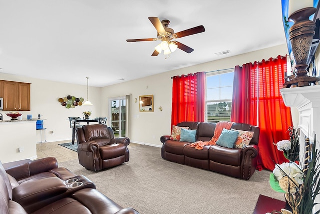 carpeted living room featuring ceiling fan