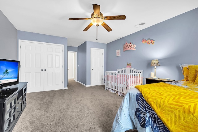 carpeted bedroom with ceiling fan and a closet