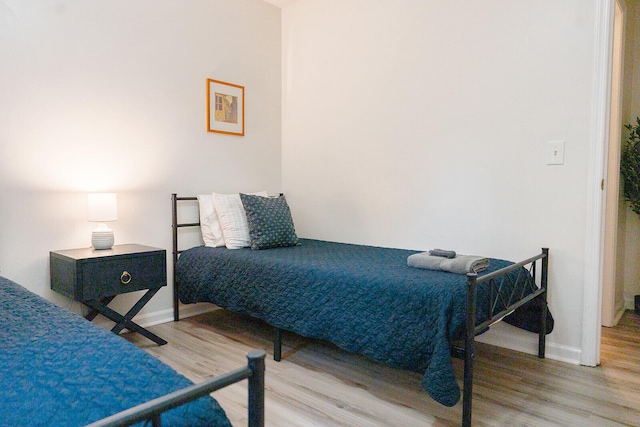 bedroom featuring light wood-type flooring