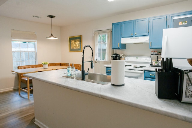 kitchen with sink, blue cabinetry, white electric range, and decorative light fixtures