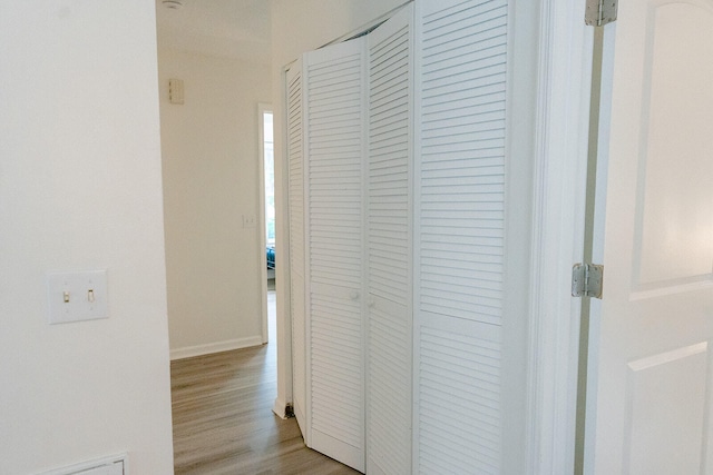 hallway with light wood-type flooring