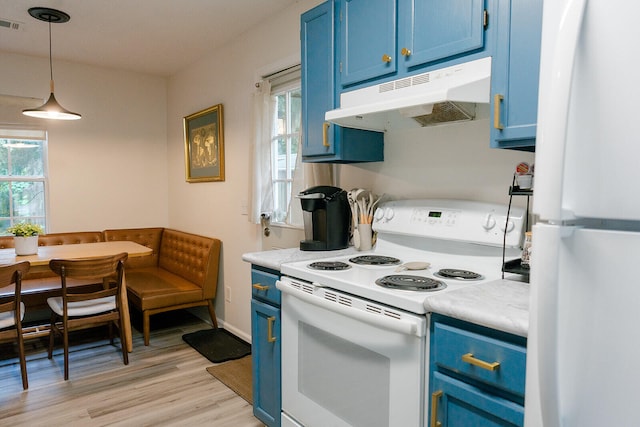 kitchen with hanging light fixtures, white appliances, light hardwood / wood-style floors, and blue cabinets