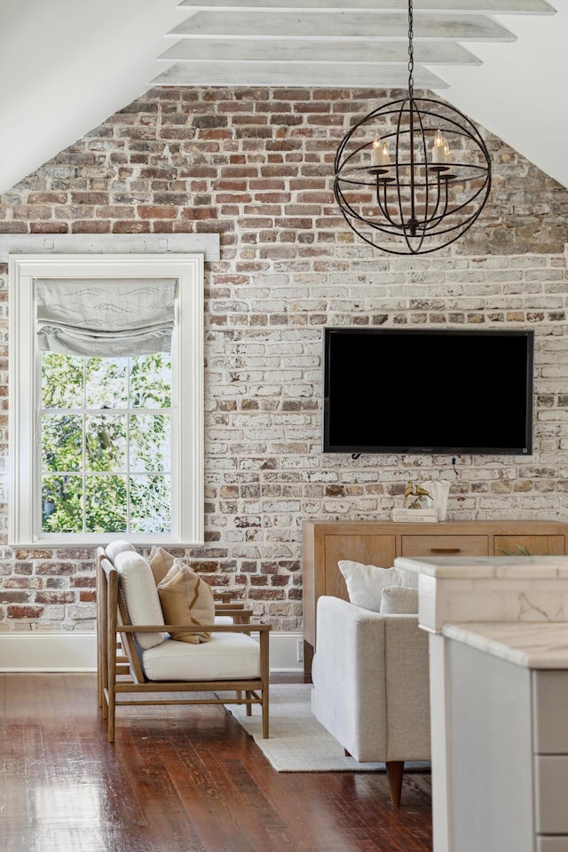 living room featuring an inviting chandelier, baseboards, vaulted ceiling, and dark wood-style flooring