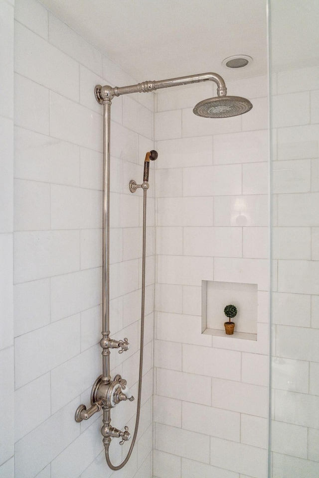 full bath featuring a tile shower