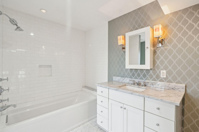 bathroom with wallpapered walls, tile patterned floors, vanity, and bathing tub / shower combination