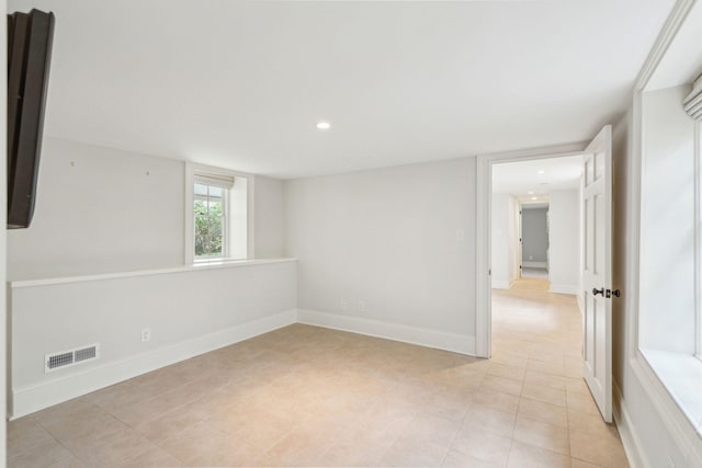 unfurnished room with recessed lighting, visible vents, baseboards, and light tile patterned floors