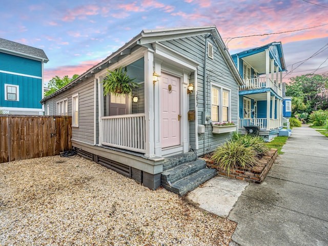 202 Fishburne St, Charleston, SC 29403 - shotgun-style home with a porch and a balcony
