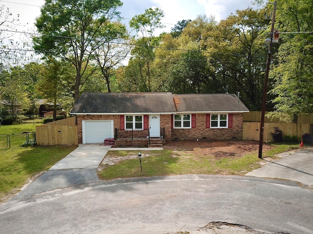 single story home with a front lawn and a garage