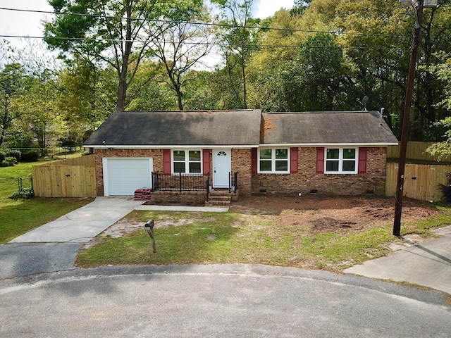 ranch-style house with a front lawn and a garage