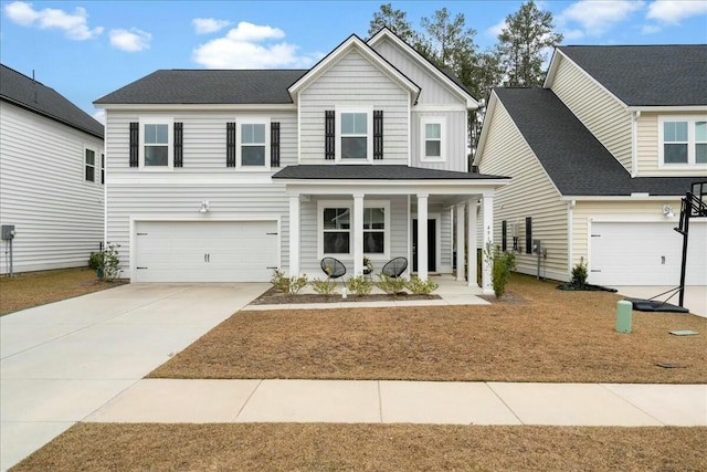 view of front property with a garage and covered porch