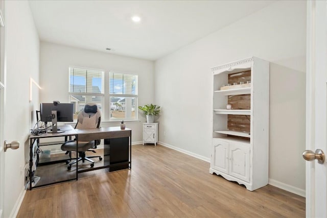 office with light hardwood / wood-style flooring