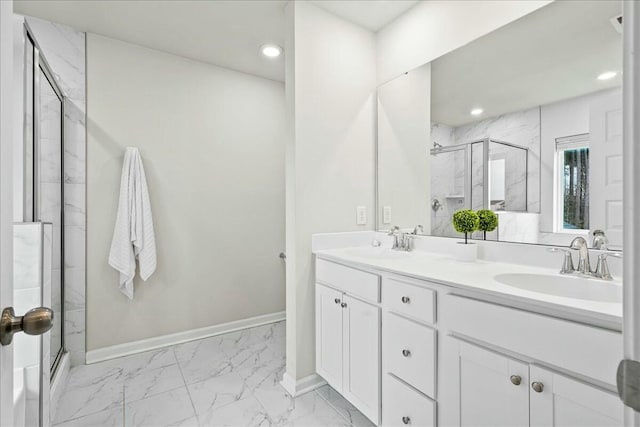 bathroom with walk in shower and vanity