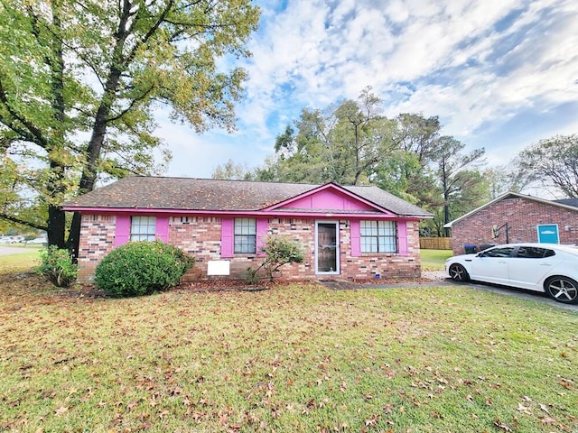 single story home with a front yard