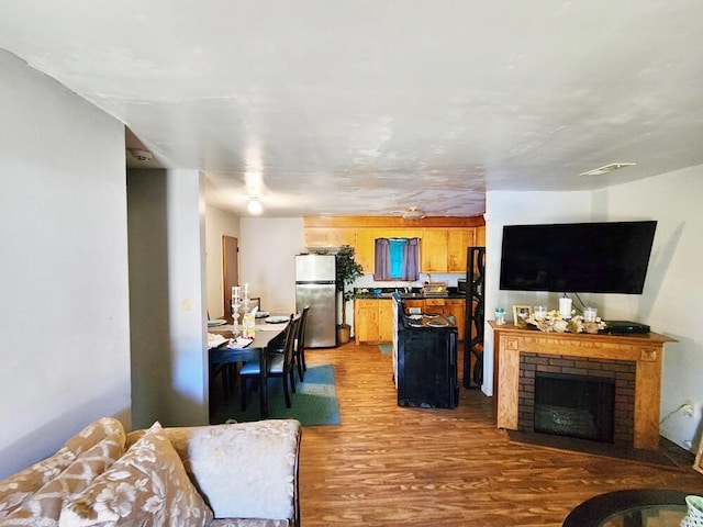 living room featuring hardwood / wood-style floors and a fireplace