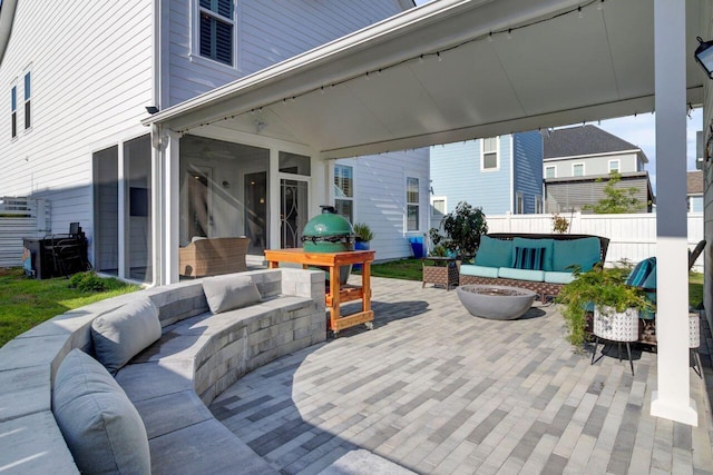 view of patio featuring fence and an outdoor hangout area