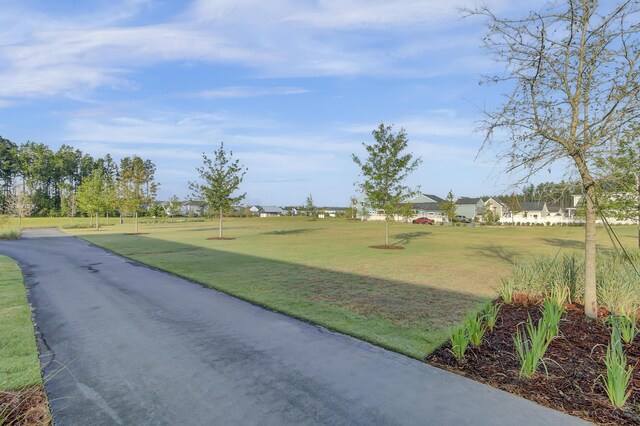 surrounding community featuring a yard