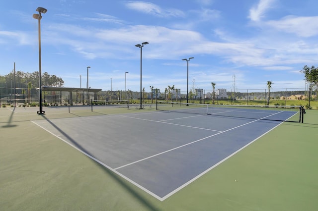 view of tennis court with fence