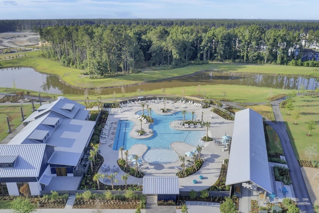 drone / aerial view featuring a water view and a forest view