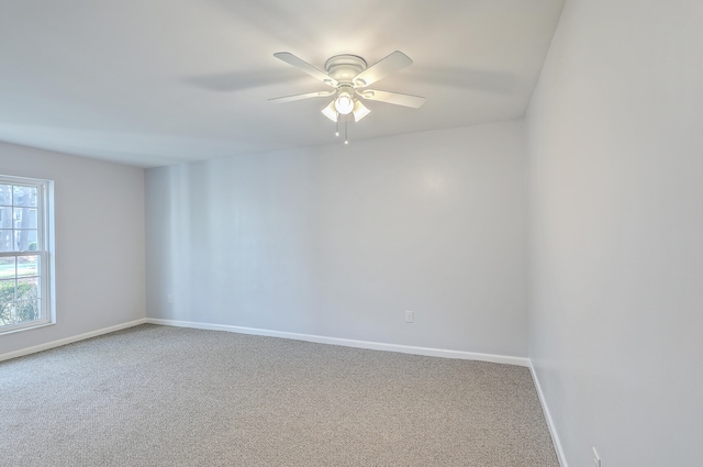 carpeted empty room with ceiling fan