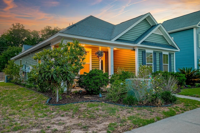 1589 Seabago Dr, Charleston, SC 29414 - view of front of house featuring roof with shingles and covered porch