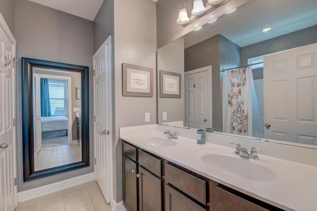 1589 Seabago Dr, Charleston, SC 29414 - ensuite bathroom featuring double vanity, tile patterned flooring, and baseboards
