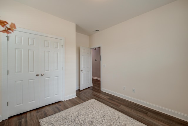 1589 Seabago Dr, Charleston, SC 29414 - unfurnished bedroom featuring dark wood-type flooring, baseboards, and a closet