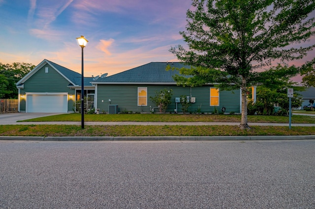 1589 Seabago Dr, Charleston, SC 29414 - view of front facade featuring central AC unit, driveway, and an attached garage