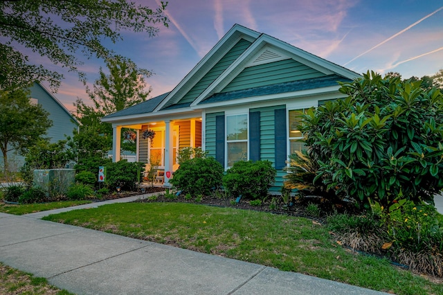 1589 Seabago Dr, Charleston, SC 29414 - view of front of property with a front yard and a porch