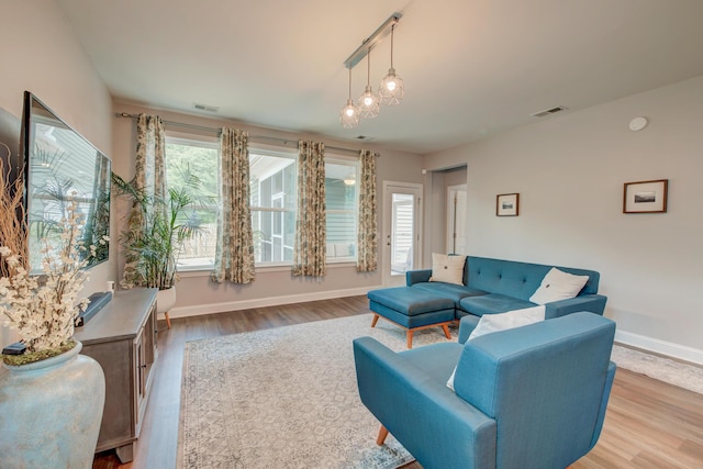 1589 Seabago Dr, Charleston, SC 29414 - living room featuring light wood finished floors, healthy amount of natural light, and baseboards