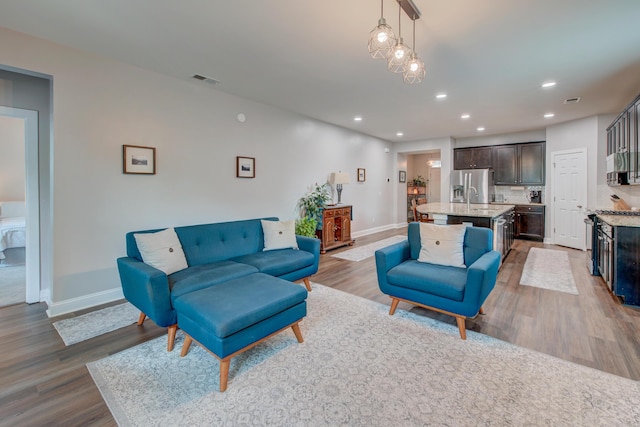 1589 Seabago Dr, Charleston, SC 29414 - living room with wood finished floors, baseboards, and recessed lighting